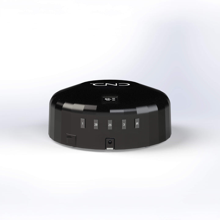 Back of black nail lamp with buttons on a white background