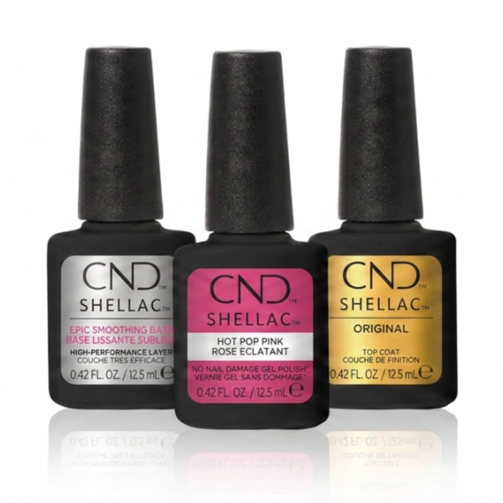 Three bottles of CND Shellac nail polish on a white background
