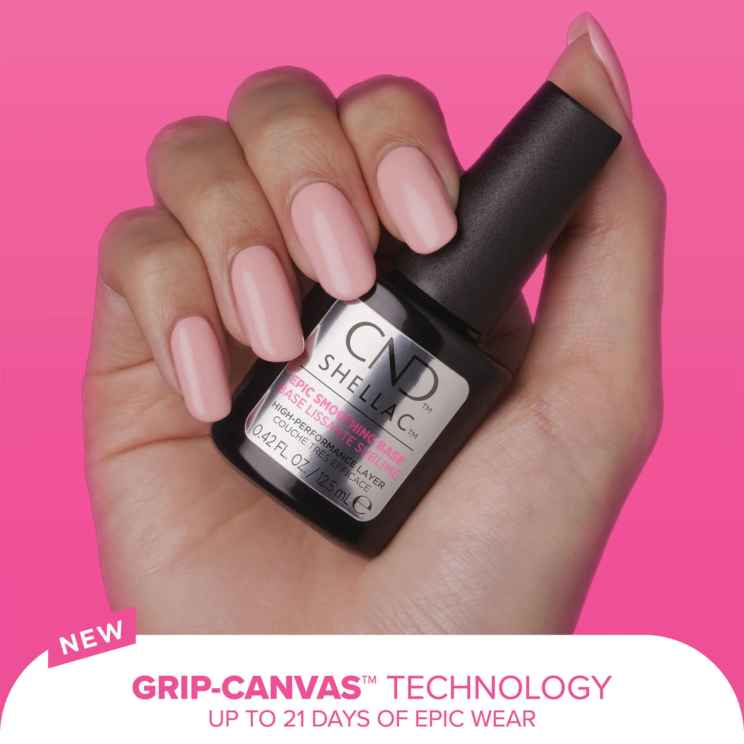 Hand holding a CND SHELLAC  EPIC SMOOTHING BASE bottle with a pink background and text against a white background reading "Grip Canvas Technology Up to 21 Days of Epic Wear".